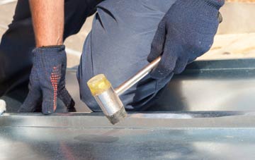 Down metal flat roofing repairs